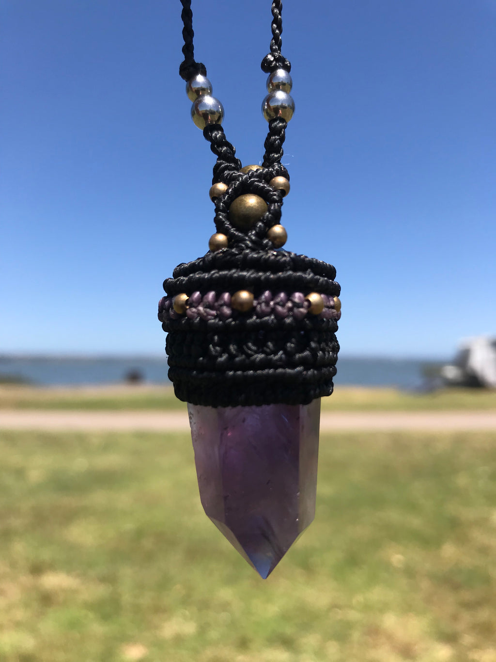 Amethyst Point wrapped in Linhasita