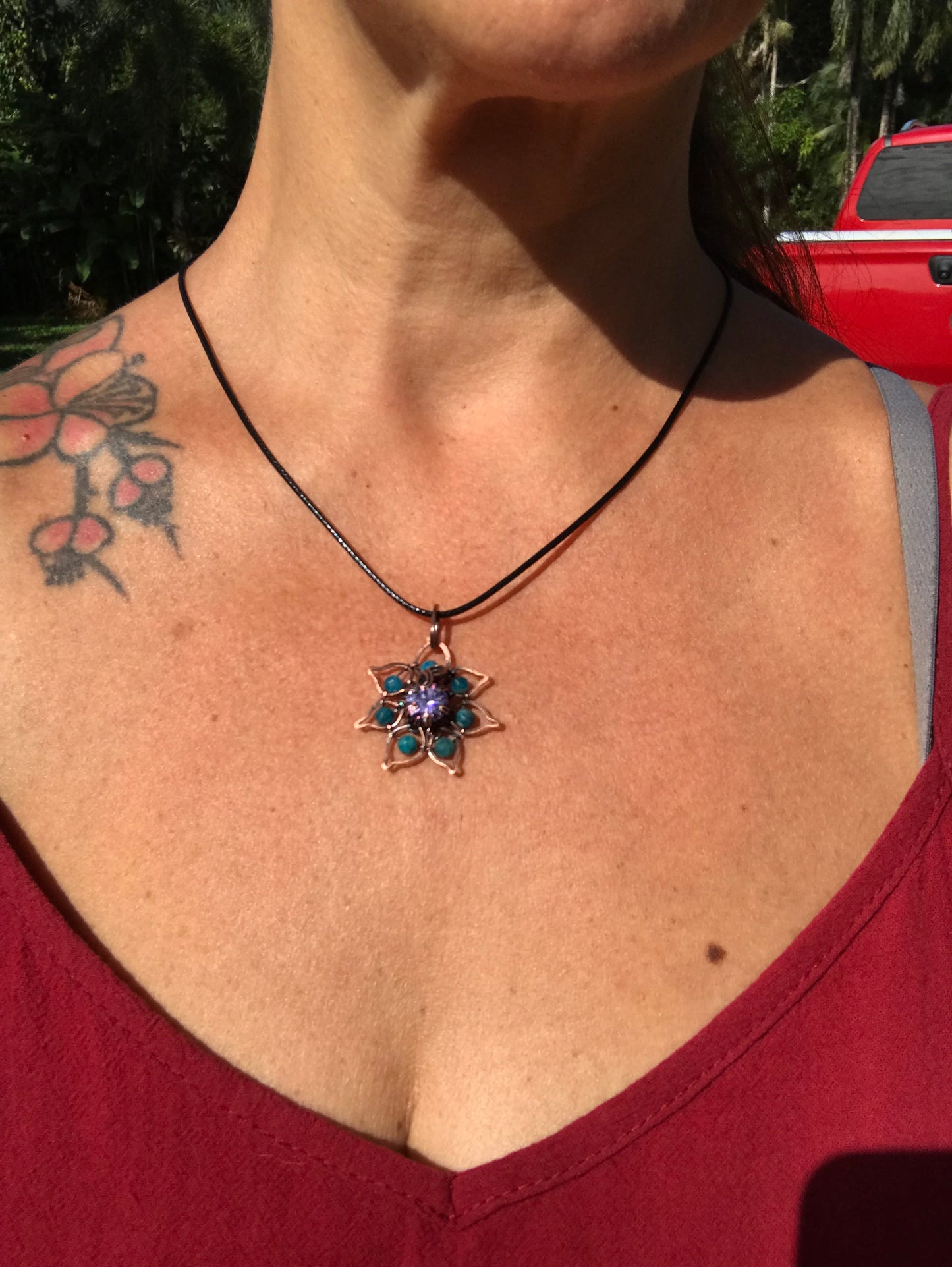 Copper crafted lotus flower pendant with Apatite