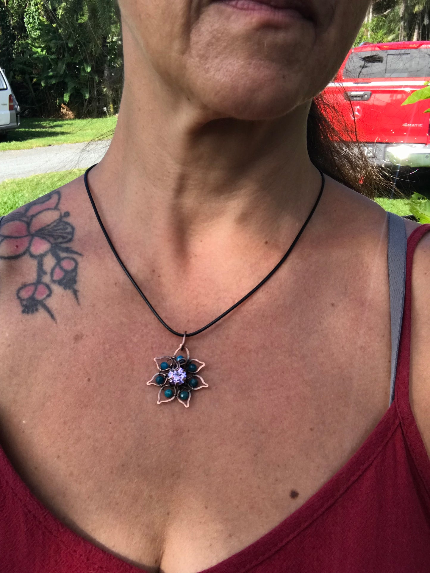 Copper crafted lotus flower pendant with Apatite