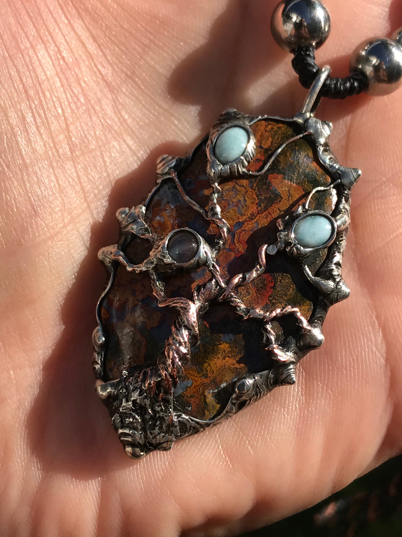 Twisted tree on brecciated jasper adorned with larimar and moonstone….tigereye in the strap