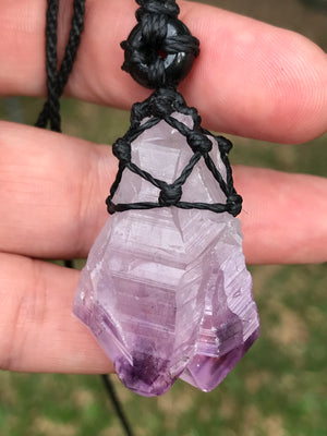 Rough Amethyst Point and black onyx wrapped in Linhasita