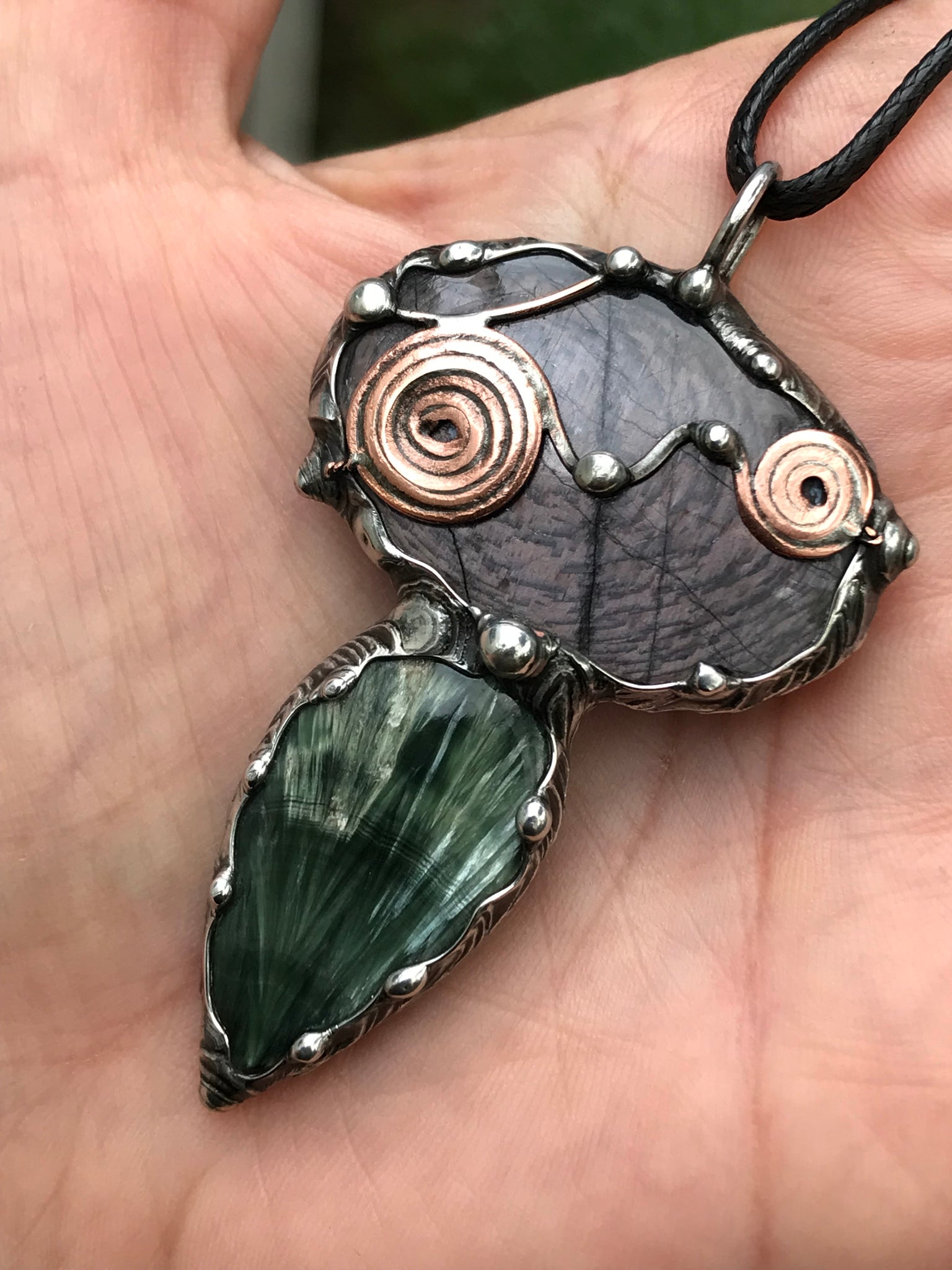 Double spiralled Hypersthene and Seraphinite pendant