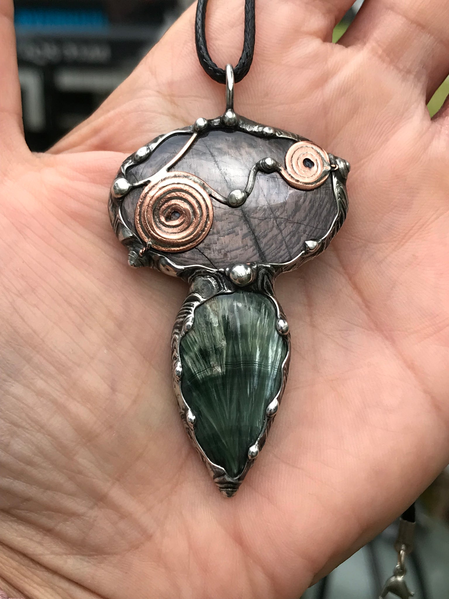 Double spiralled Hypersthene and Seraphinite pendant