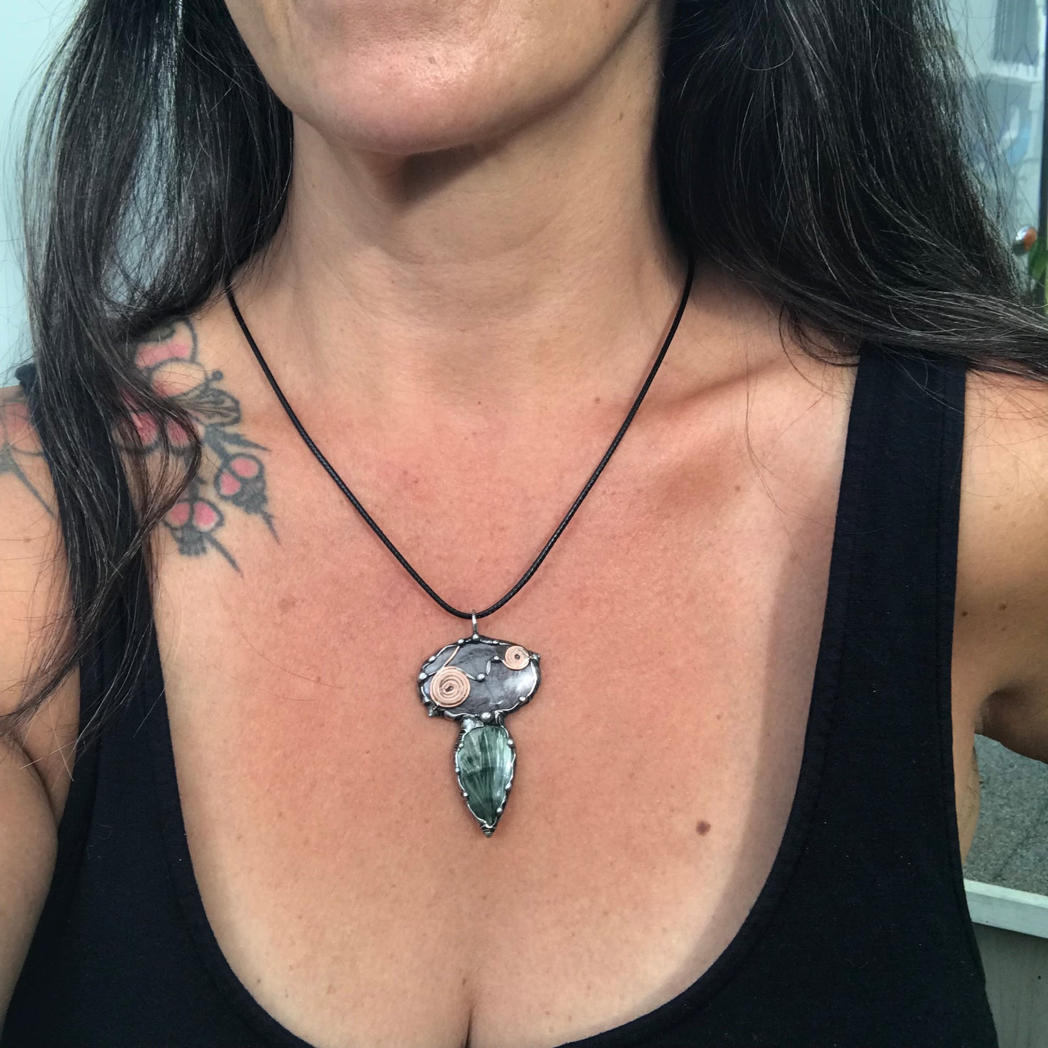 Double spiralled Hypersthene and Seraphinite pendant