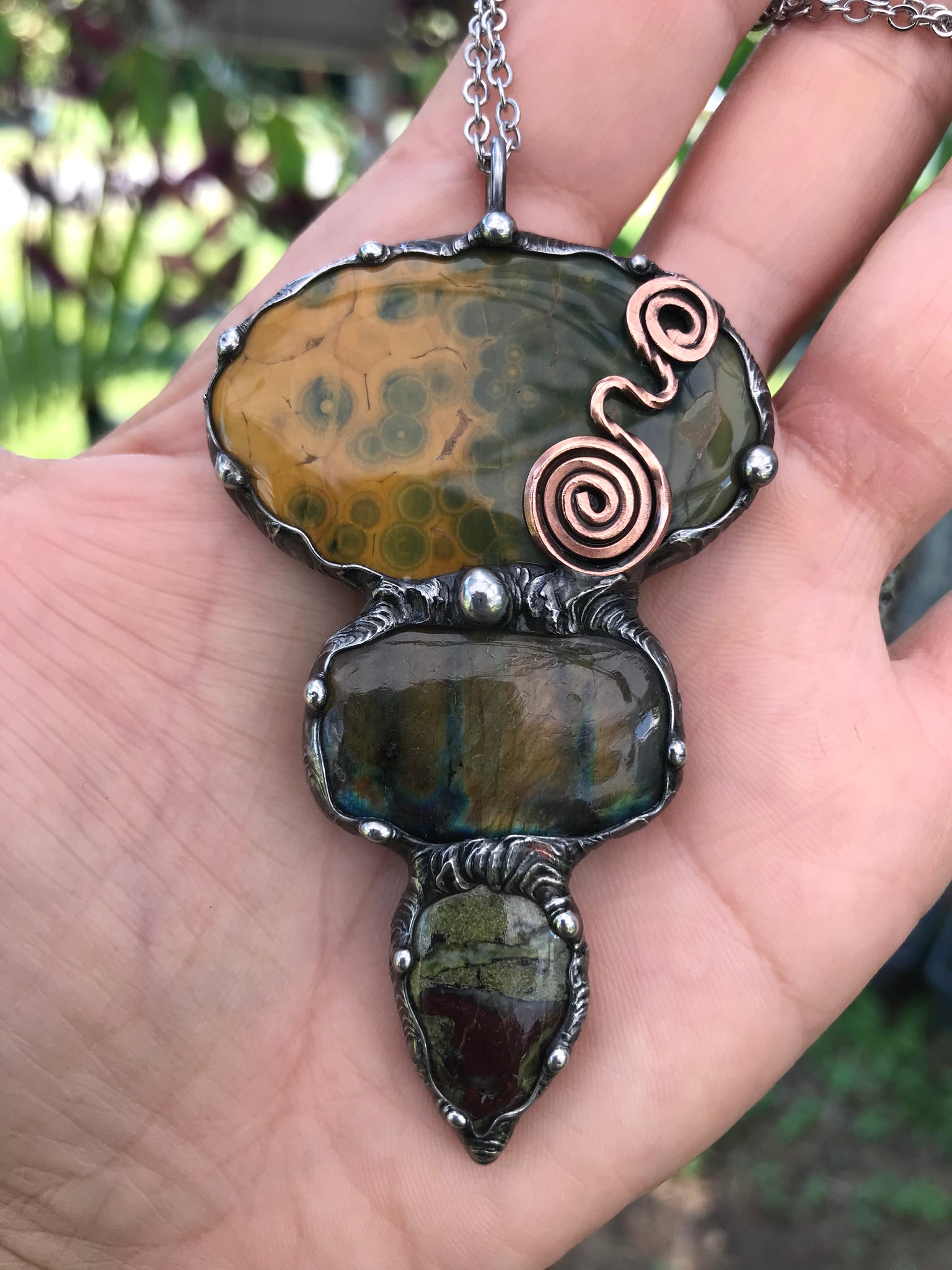 Ocean jasper Labradorite and Dragon Blood Jasper crystal pendant adorned eith a double spiral symbol