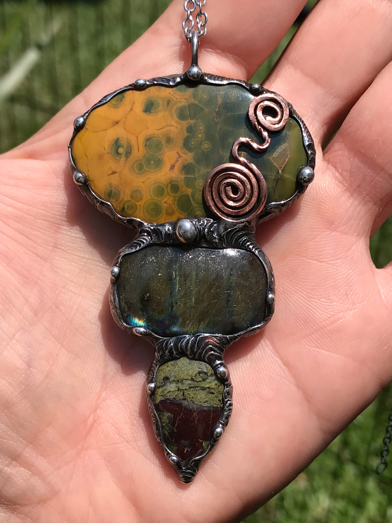 Ocean jasper Labradorite and Dragon Blood Jasper crystal pendant adorned eith a double spiral symbol