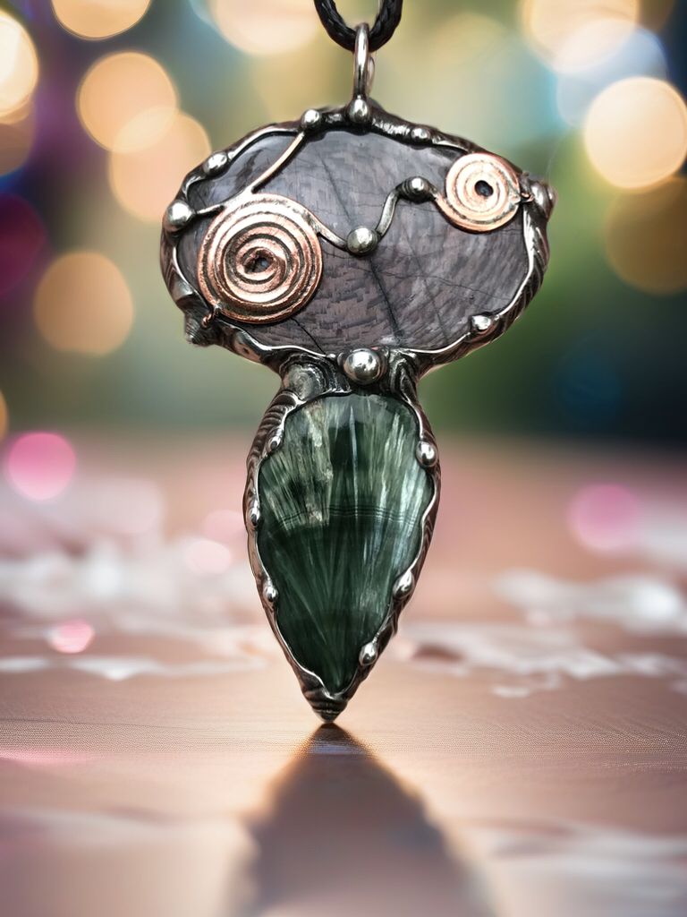 Double spiralled Hypersthene and Seraphinite pendant