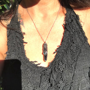 Aegirine and smoky Quartz point adorned with labradorite and rainbow moonstone