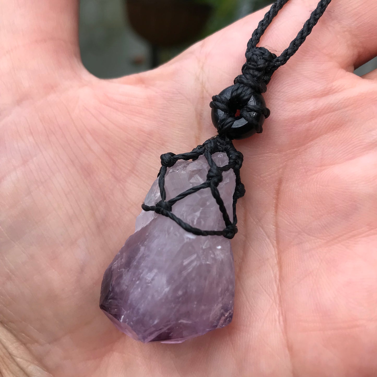 Rough Amethyst Point and black onyx wrapped in Linhasita