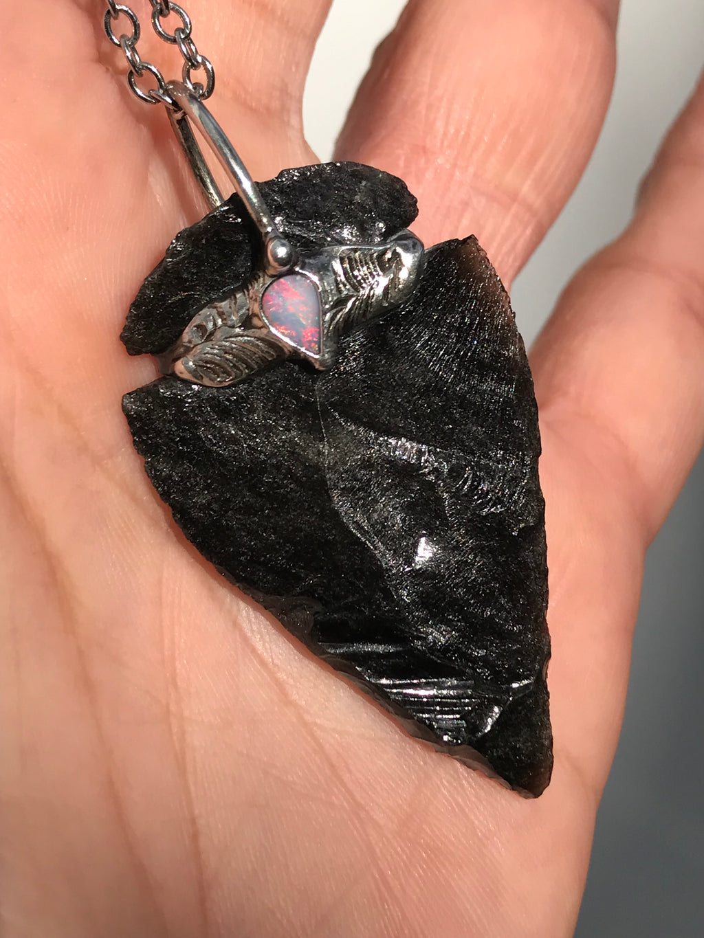 Silversheen Obsidian Arrowhead adorned with lightning ridge Opal