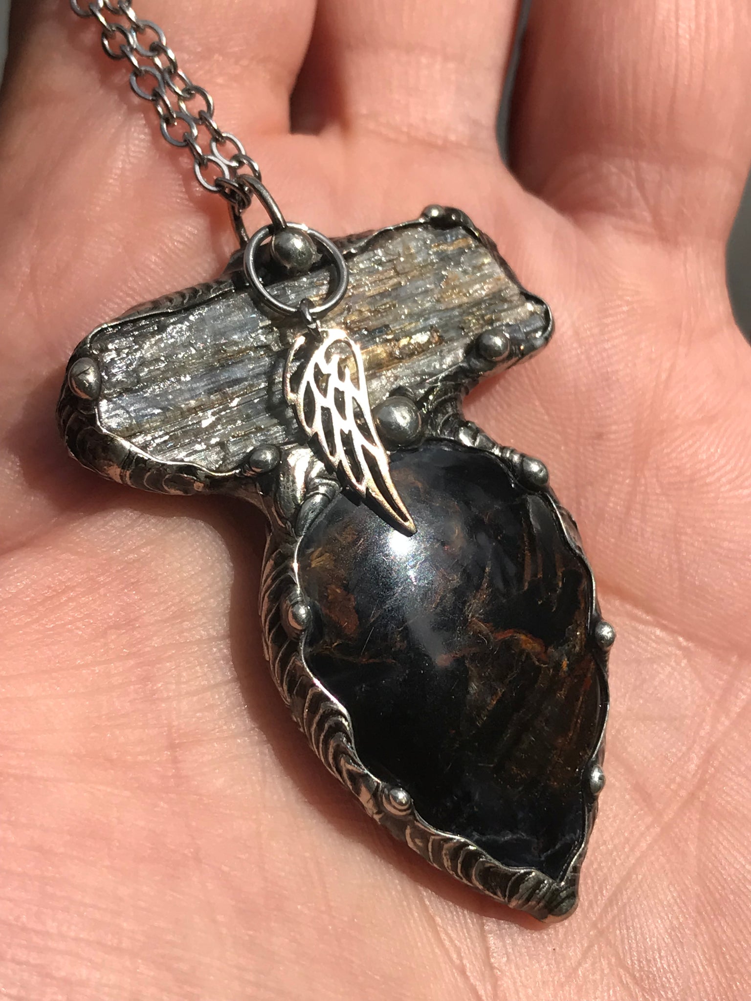 Pietersite and blue Kyanite magic adorned with a sterling silver wing