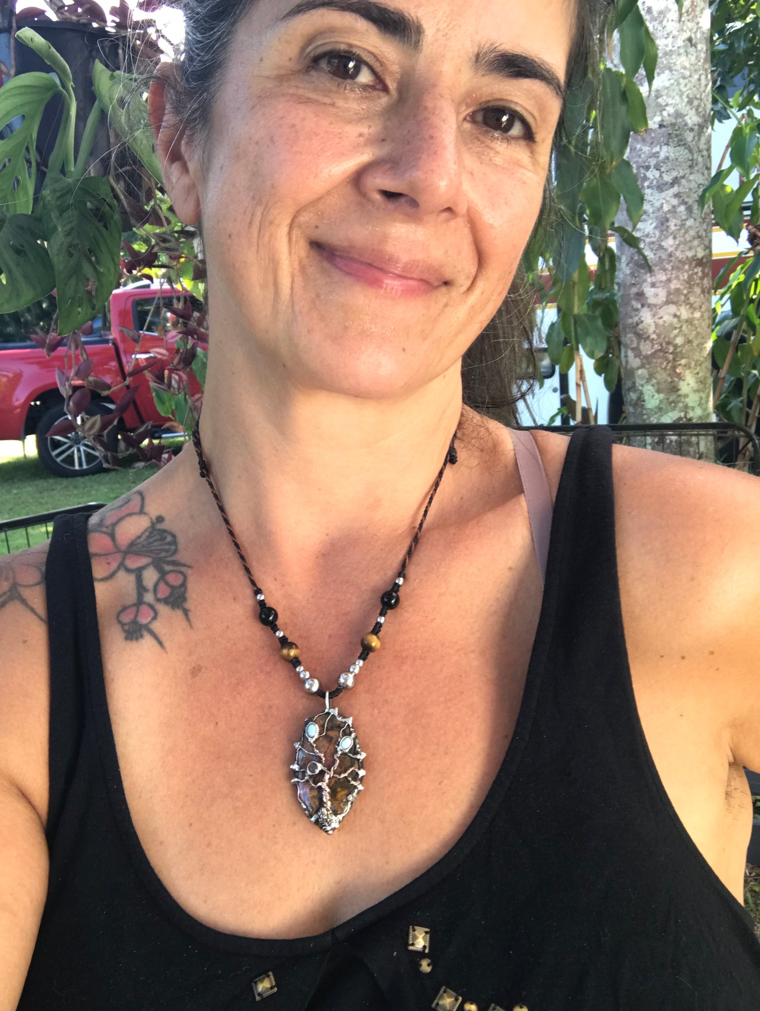 Twisted tree on brecciated jasper adorned with larimar and moonstone….tigereye in the strap