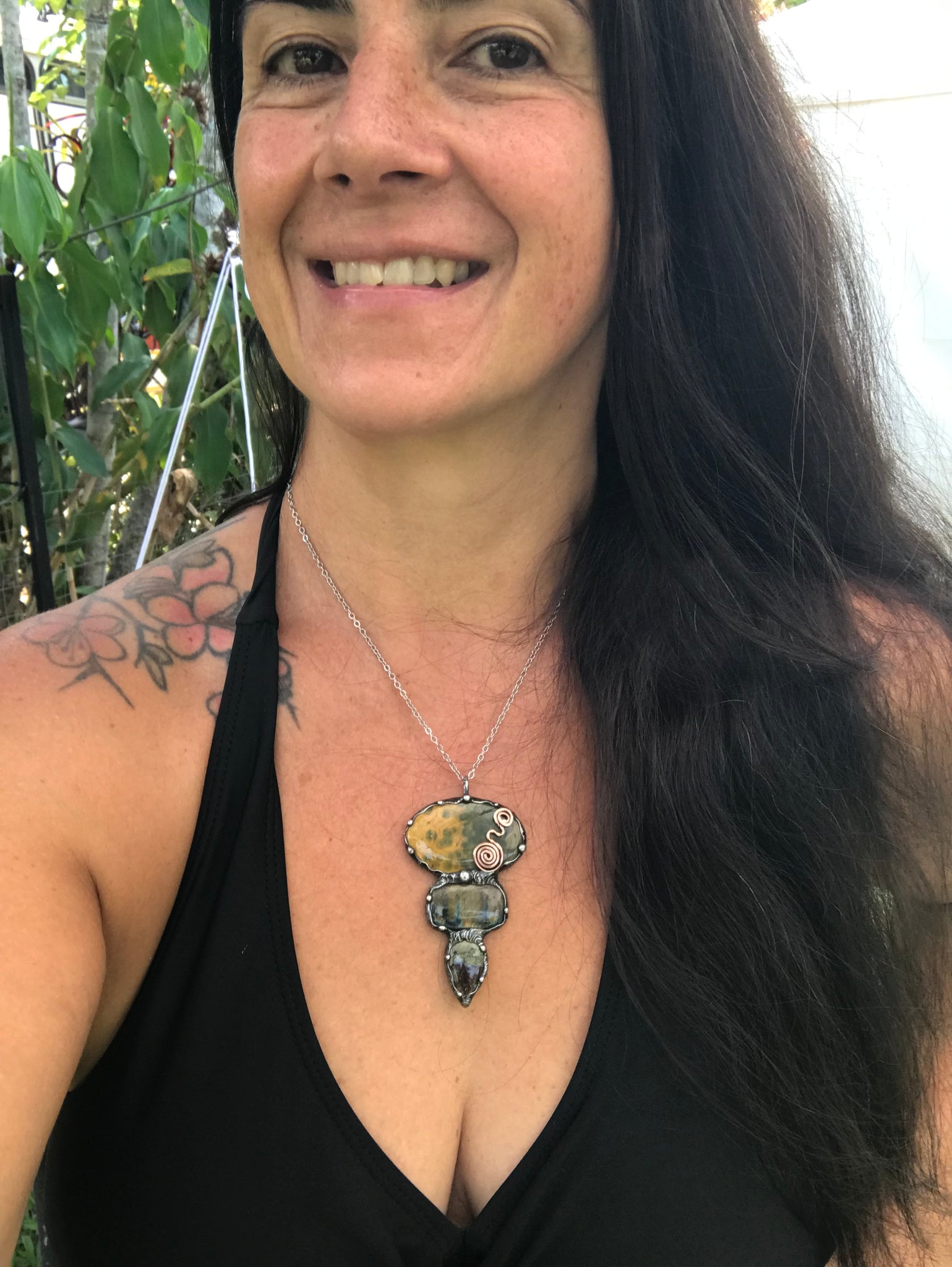 Ocean jasper Labradorite and Dragon Blood Jasper crystal pendant adorned eith a double spiral symbol