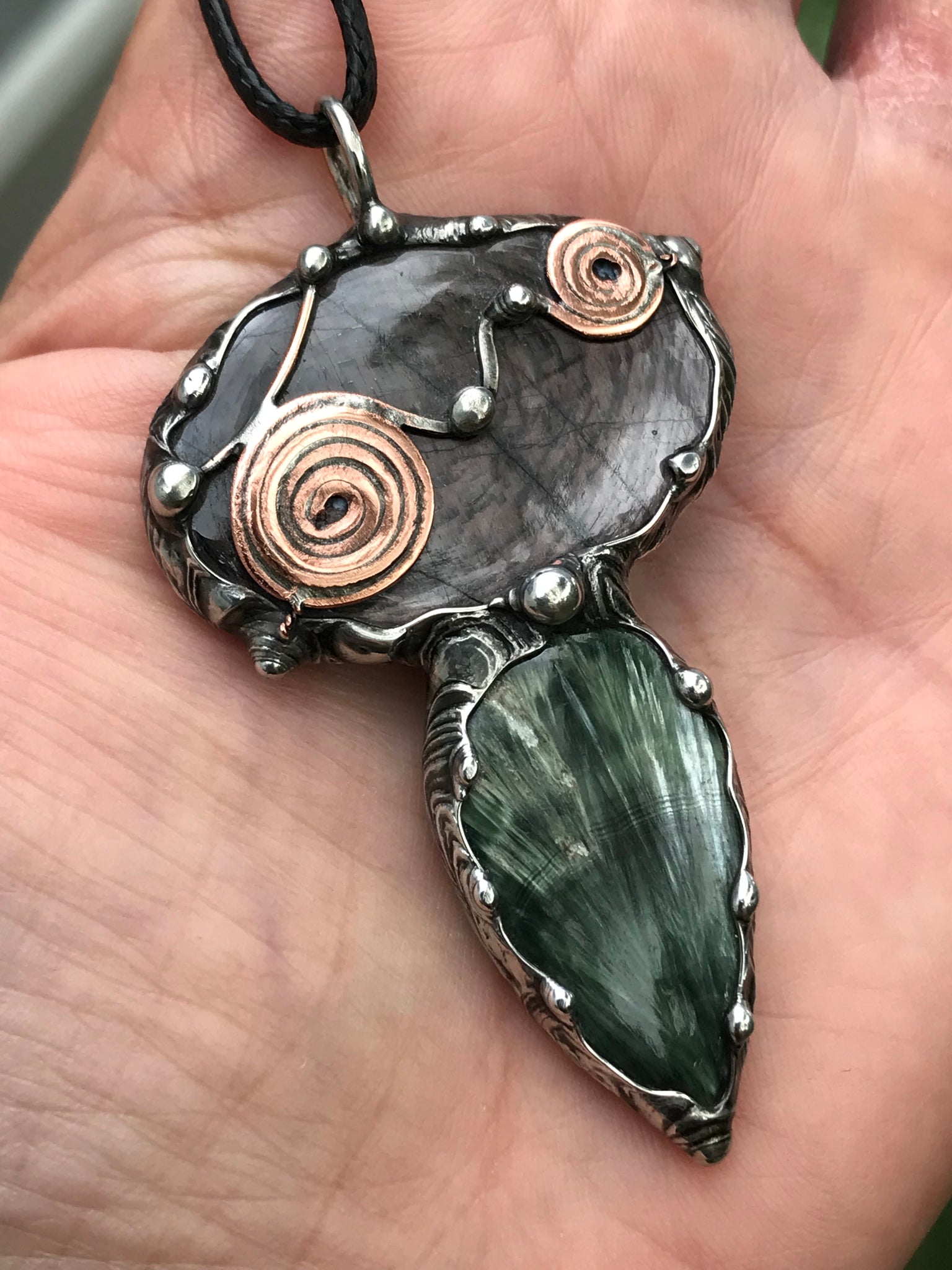 Double spiralled Hypersthene and Seraphinite pendant