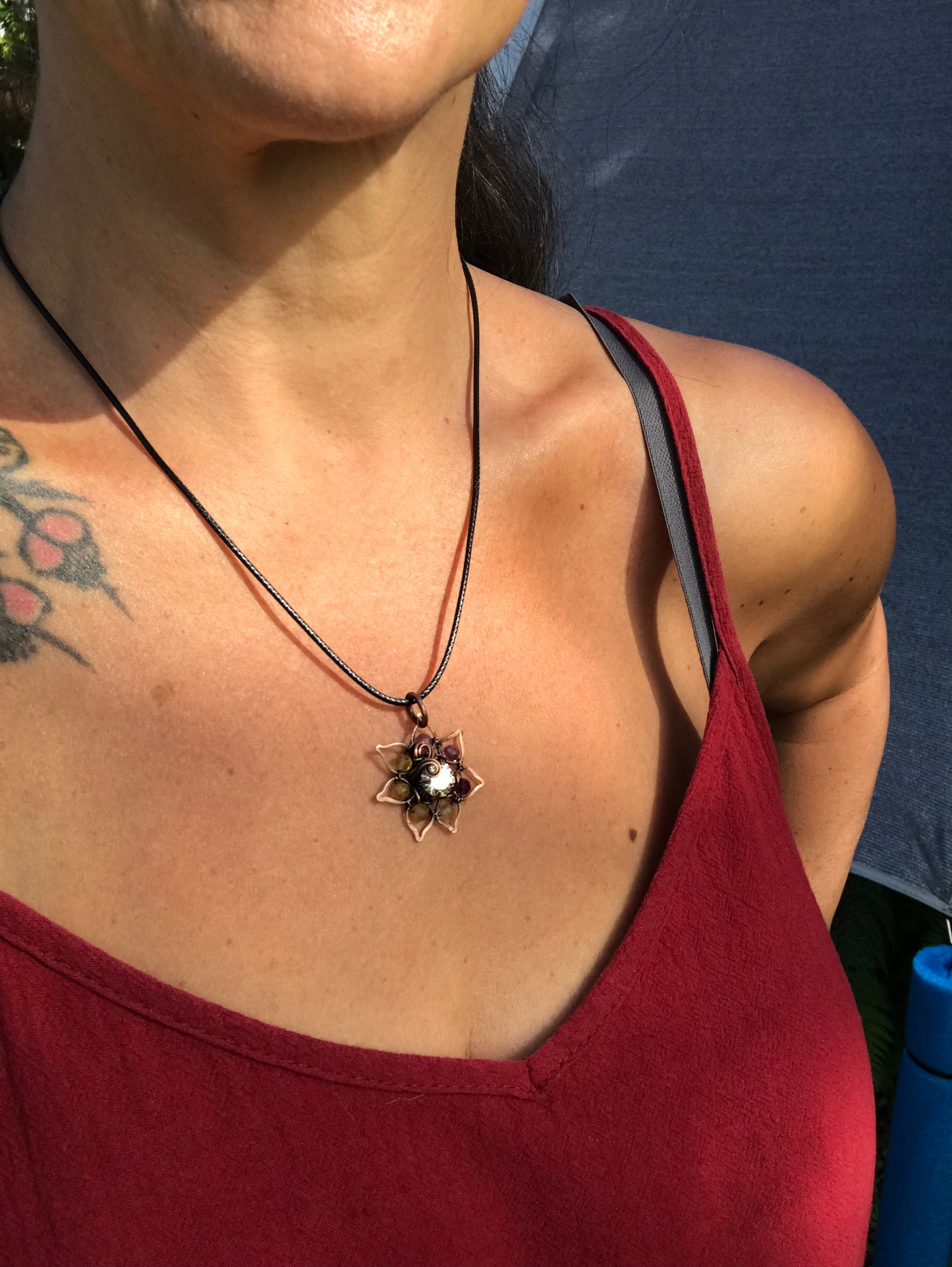 Copper crafted lotus flower pendant with Rainbow Fluorite