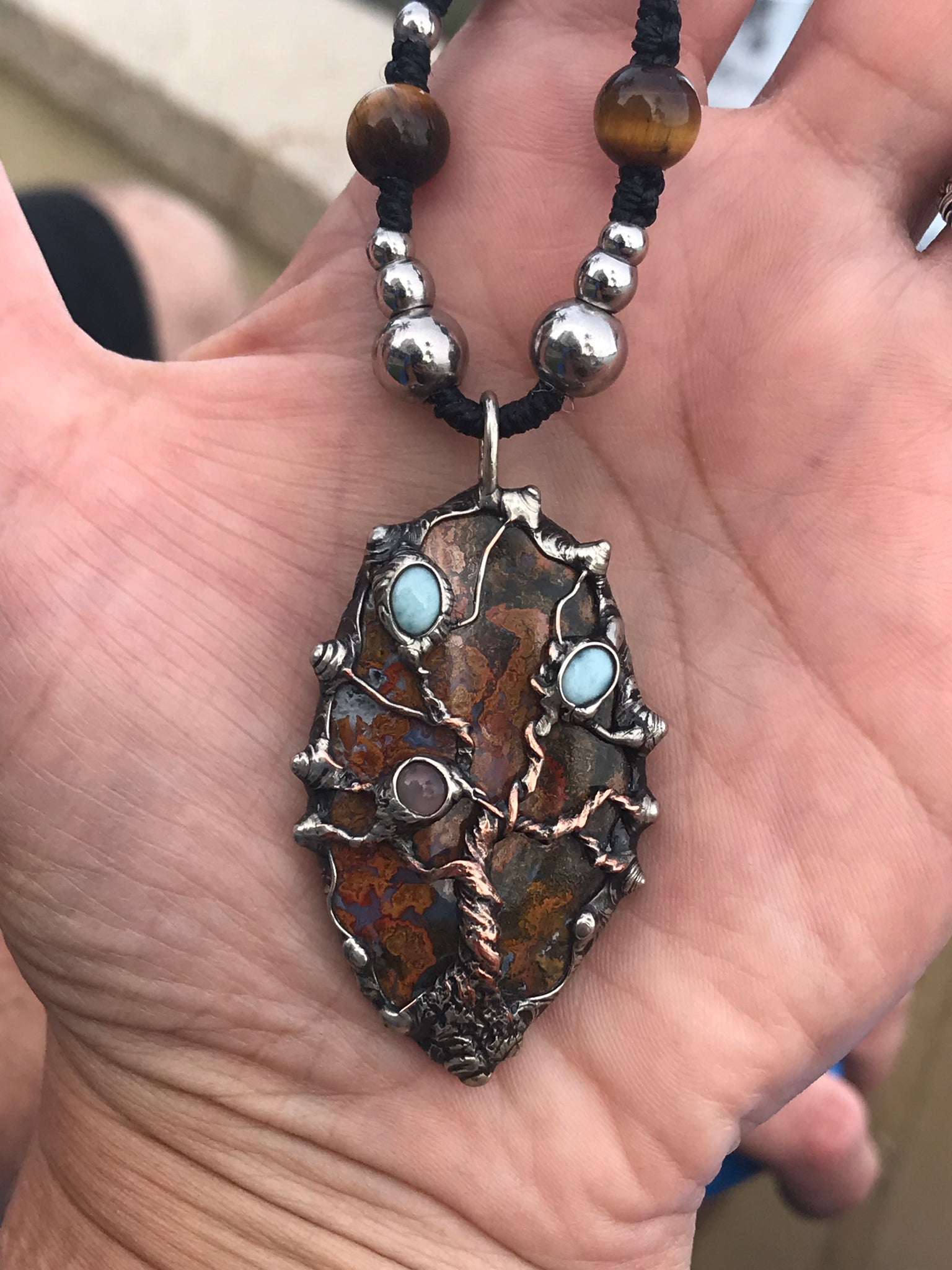 Twisted tree on brecciated jasper adorned with larimar and moonstone and tigereye beads