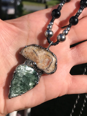 Seraphinite and fossilised coral pendant