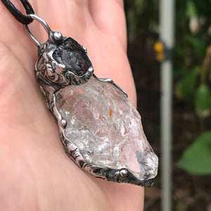 Rough Clear Quartz pendant with mineral inclusion and rainbow adorned with Australian Garnet♥️