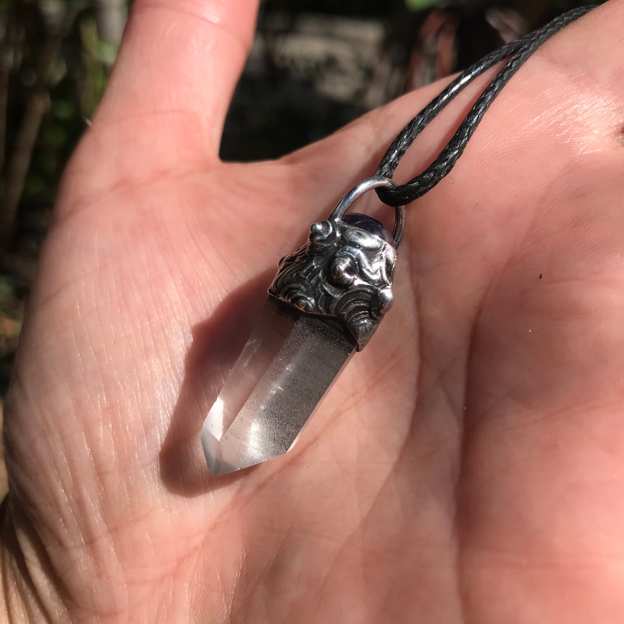 Lemurian seed crystal adorned with Amethyst