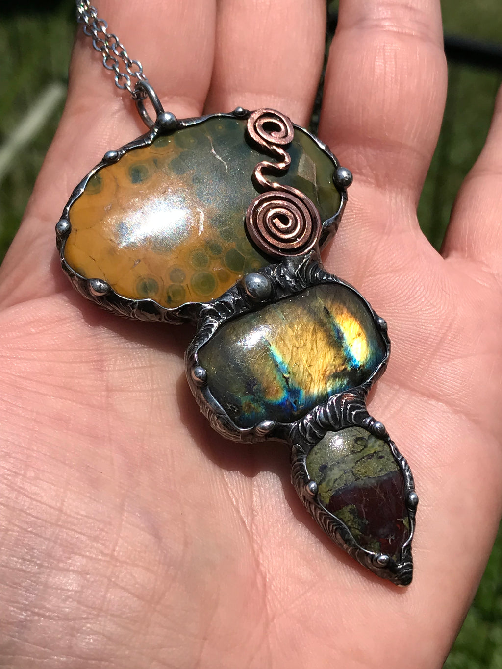 Ocean jasper Labradorite and Dragon Blood Jasper crystal pendant adorned eith a double spiral symbol