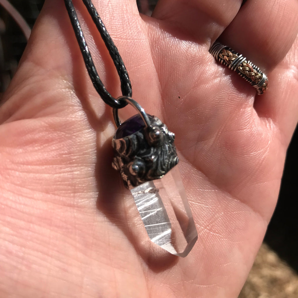 Lemurian seed crystal adorned with Amethyst