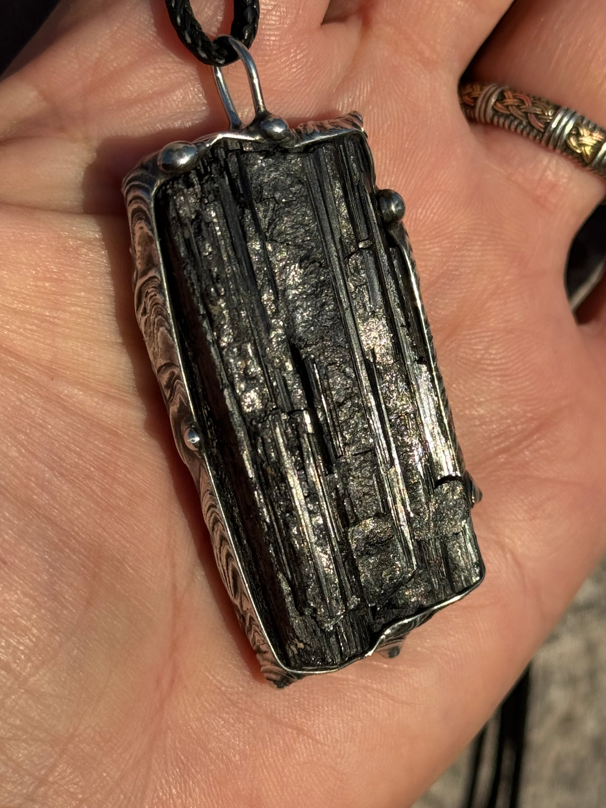 Black striated Tourmaline pendant