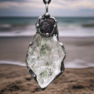 Rough Clear Quartz pendant with mineral inclusion and rainbow adorned with Australian Garnet♥️