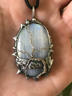 Rainbow Moonstone adorned with gold and sterling silver tree of life