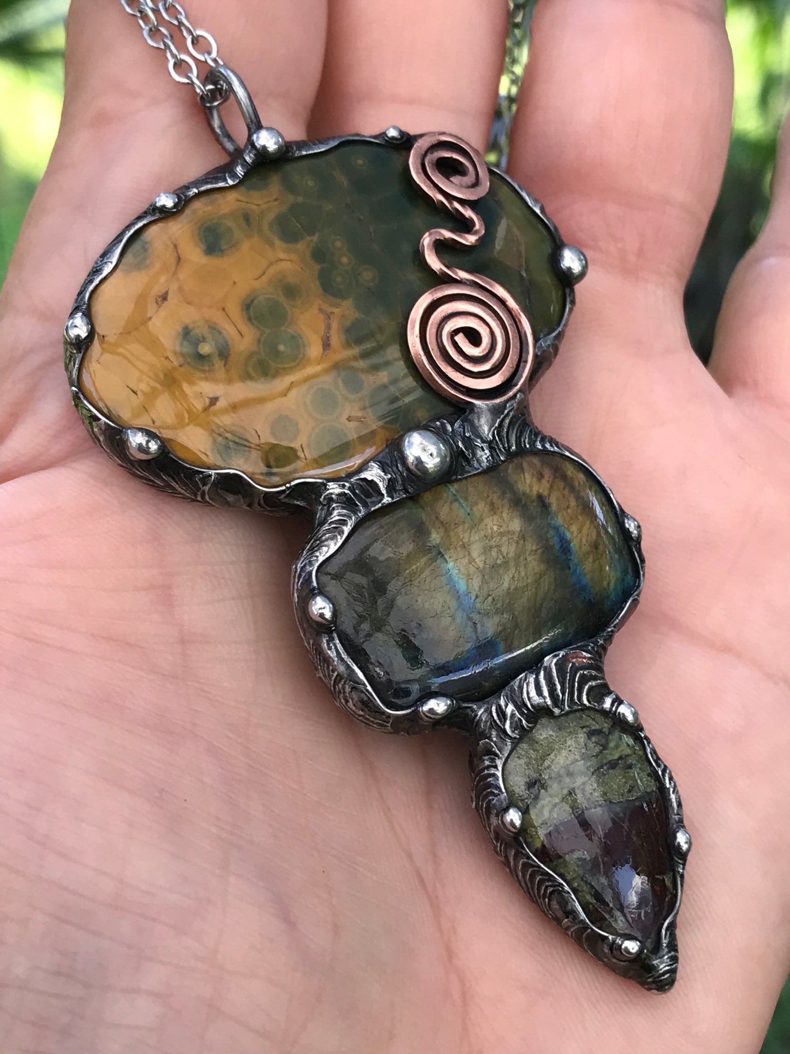 Ocean jasper Labradorite and Dragon Blood Jasper crystal pendant adorned eith a double spiral symbol