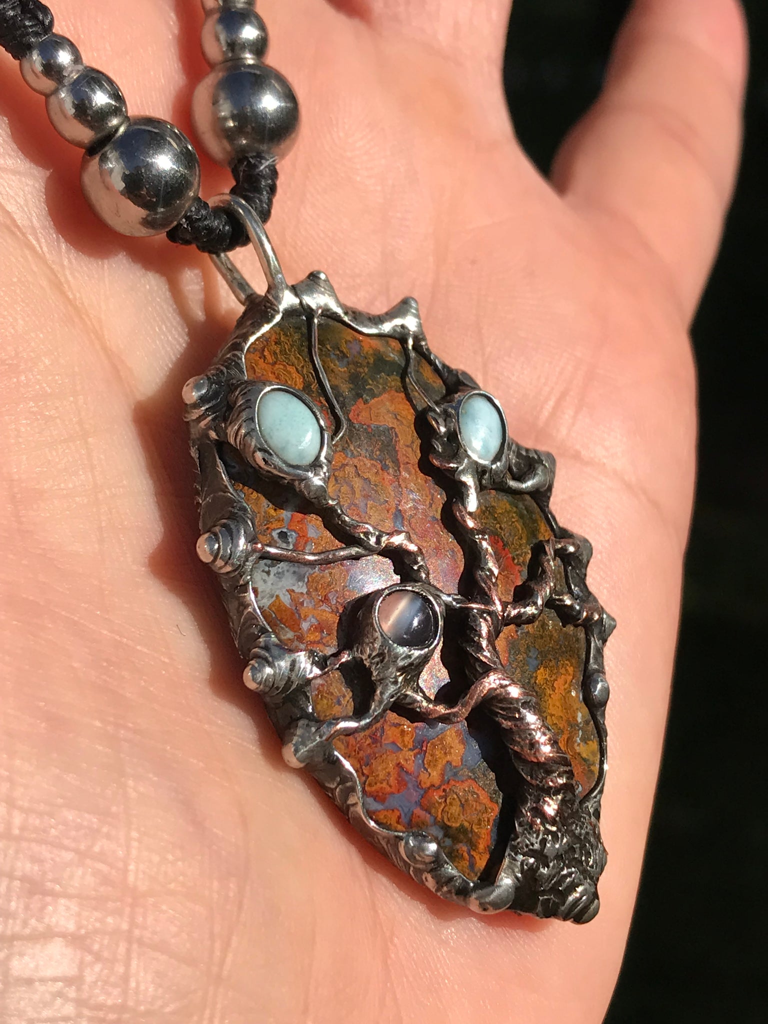 Twisted tree on brecciated jasper adorned with larimar and moonstone….tigereye in the strap