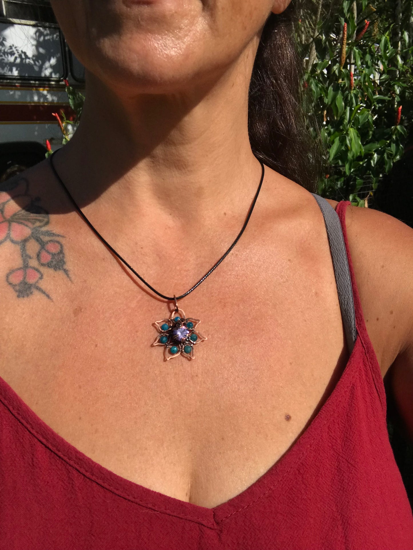Copper crafted lotus flower pendant with Apatite