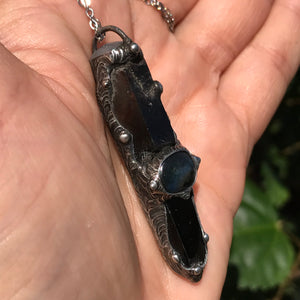 Aegirine and smoky Quartz point adorned with labradorite and rainbow moonstone