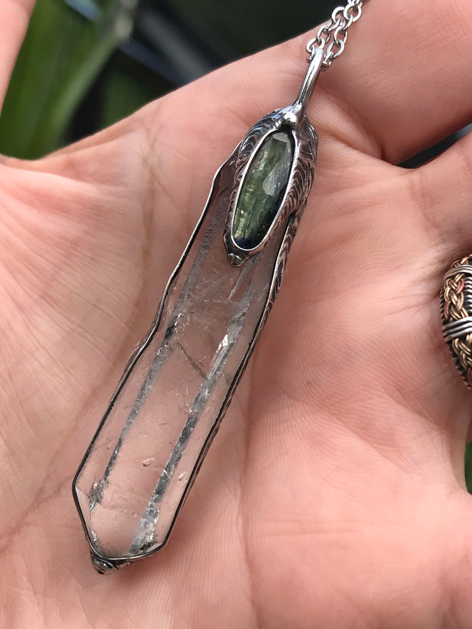 Clear Quartz crystal point with green faceted kyanite