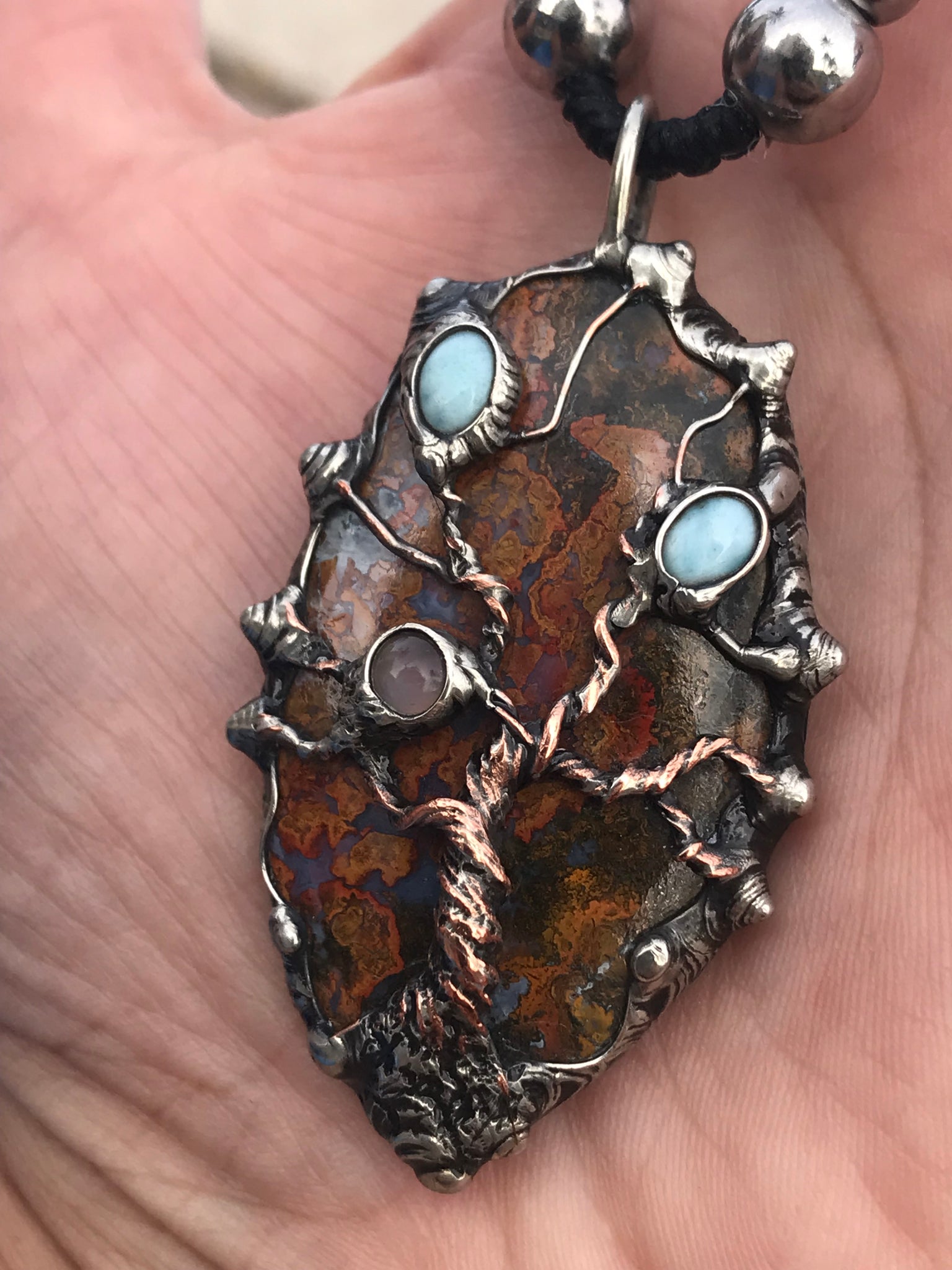Twisted tree on brecciated jasper adorned with larimar and moonstone and tigereye beads