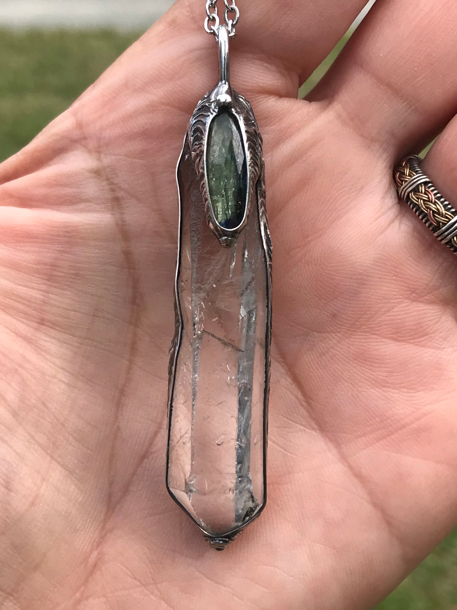 Clear Quartz crystal point with green faceted kyanite