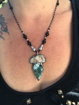 Seraphinite and fossilised coral pendant