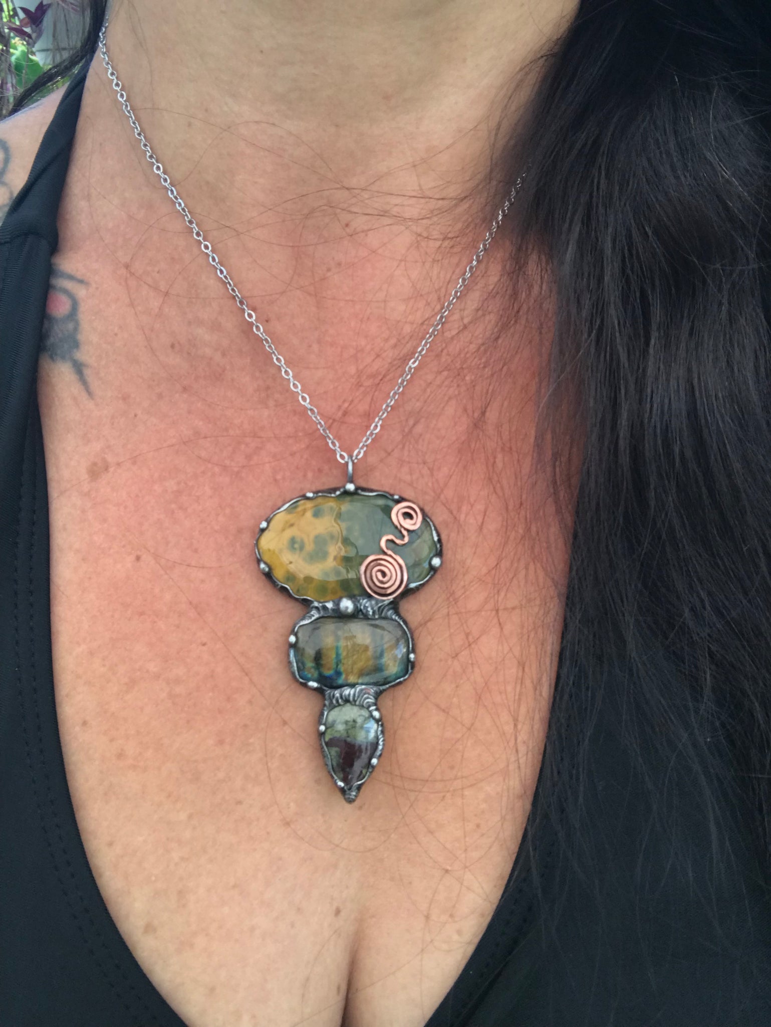 Ocean jasper Labradorite and Dragon Blood Jasper crystal pendant adorned eith a double spiral symbol