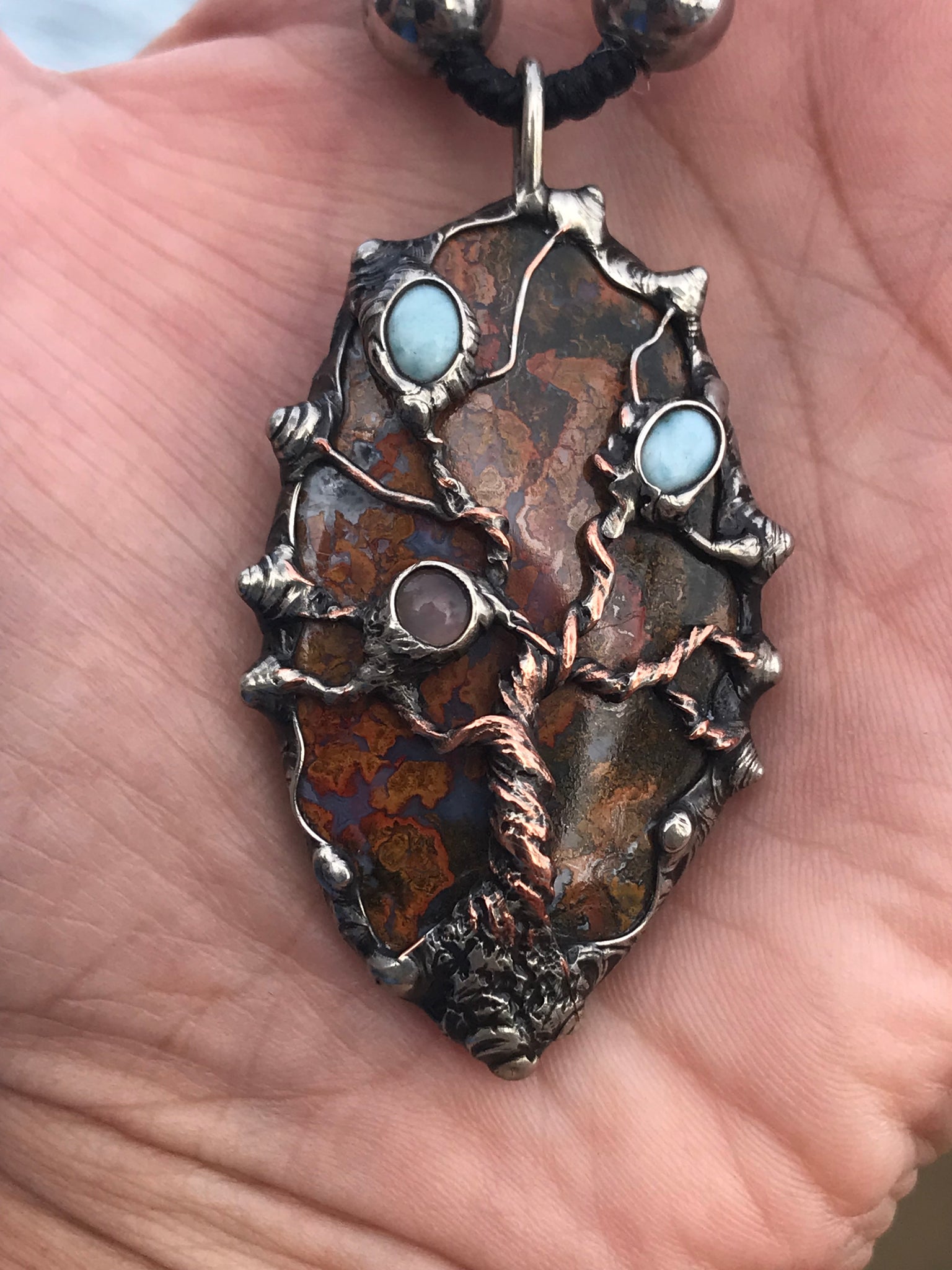 Twisted tree on brecciated jasper adorned with larimar and moonstone and tigereye beads