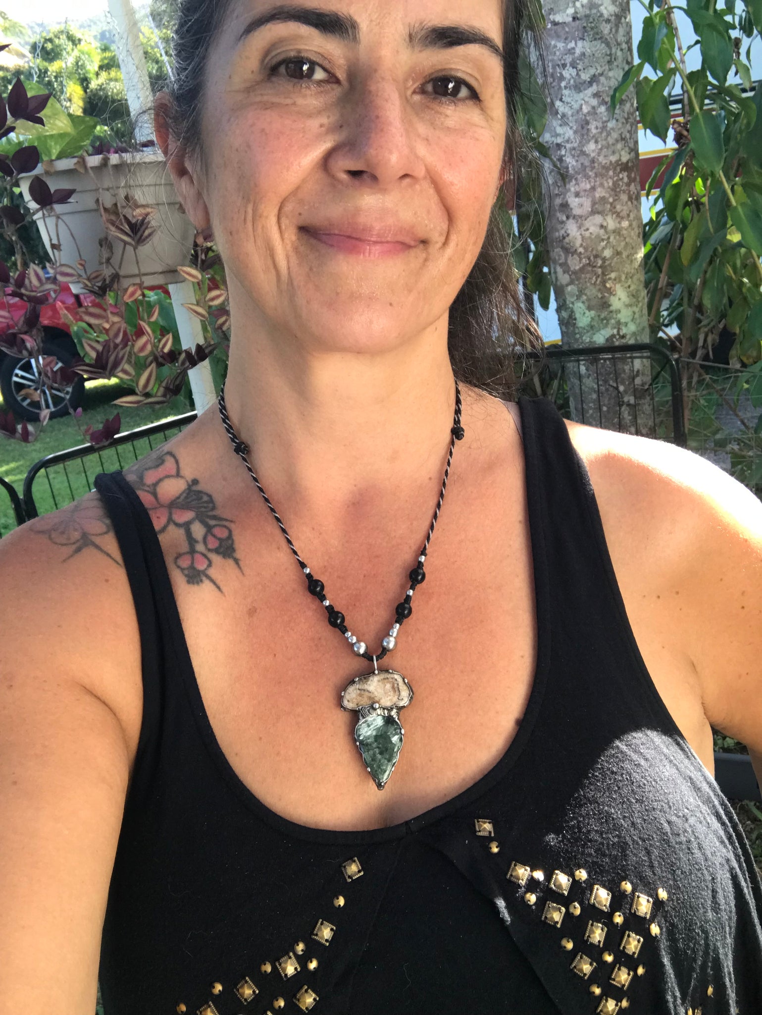 Seraphinite and fossilised coral pendant