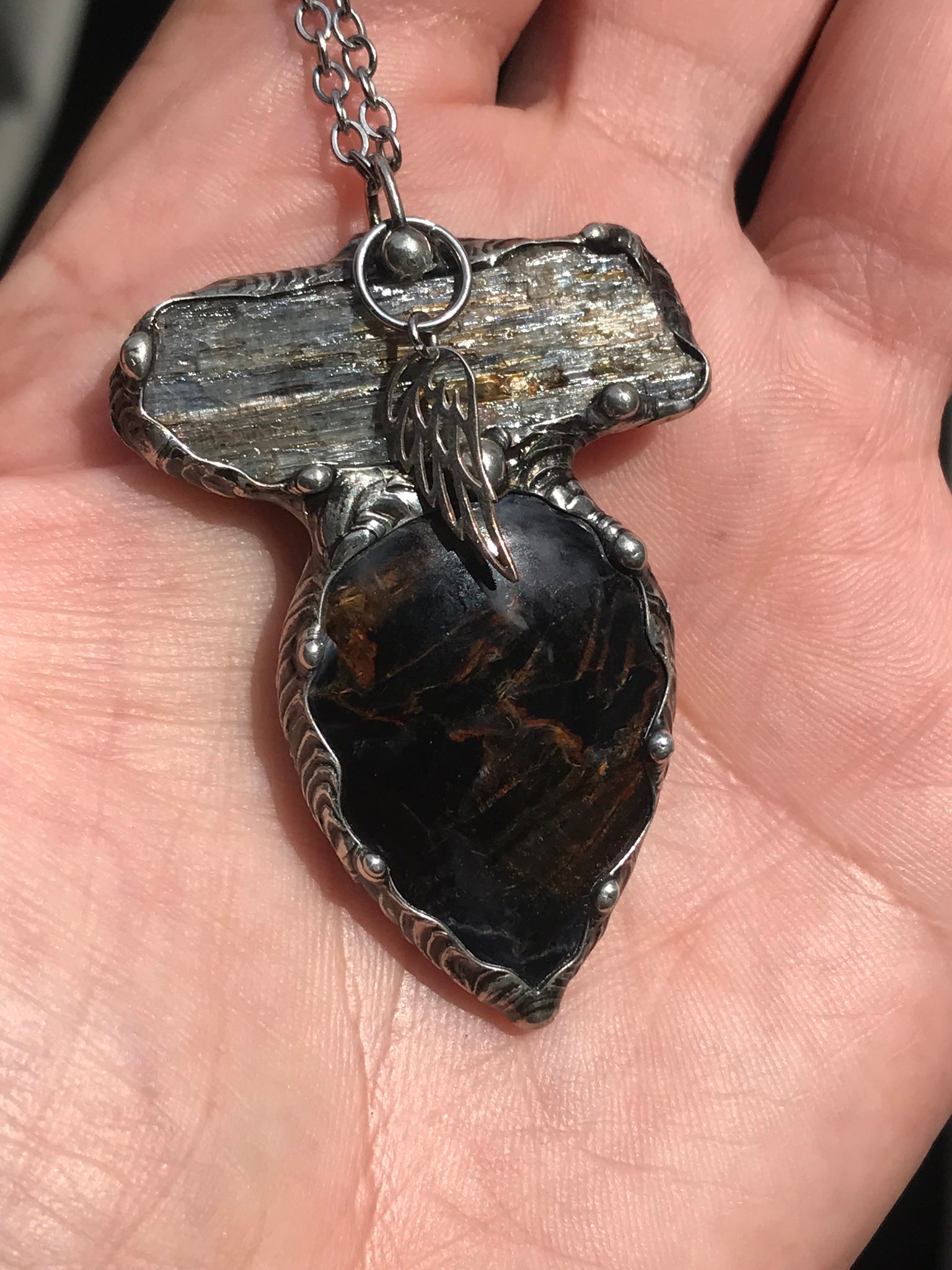 Pietersite and blue Kyanite magic adorned with a sterling silver wing