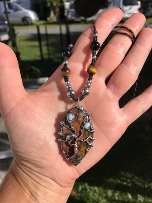 Twisted tree on brecciated jasper adorned with larimar and moonstone….tigereye in the strap