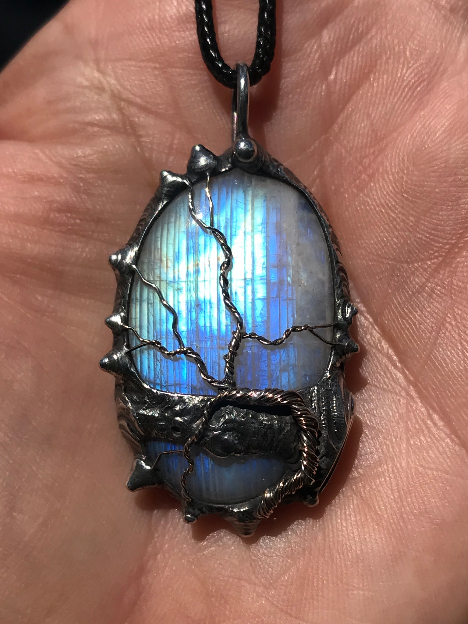 Rainbow Moonstone adorned with gold and sterling silver tree of life