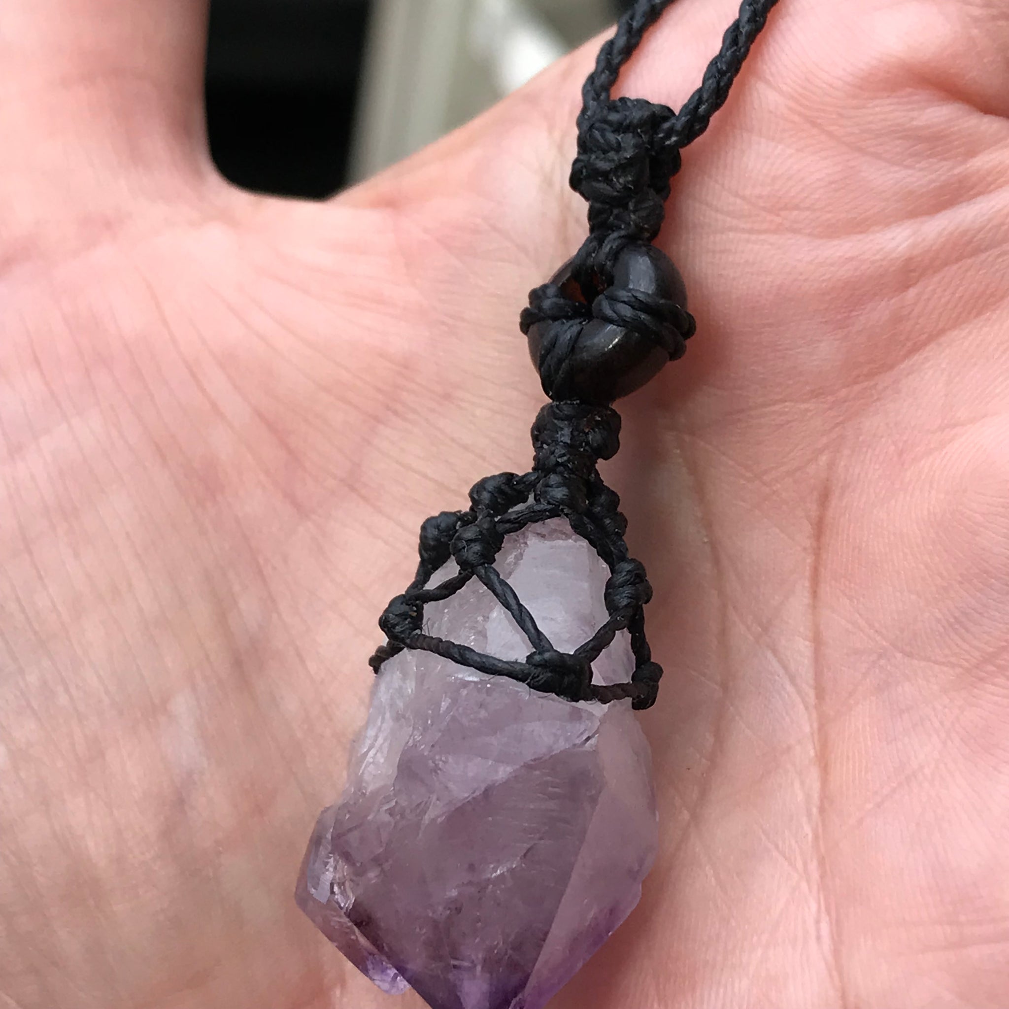 Rough Amethyst Point and black onyx wrapped in Linhasita