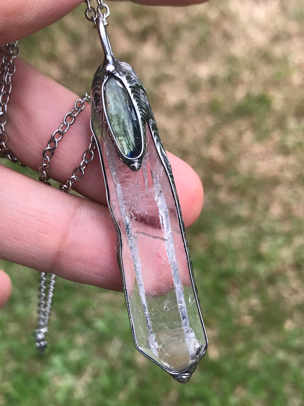 Clear Quartz crystal point with green faceted kyanite