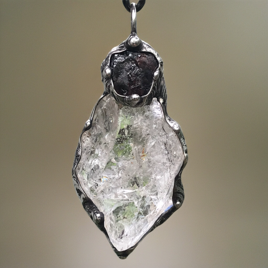 Rough Clear Quartz pendant with mineral inclusion and rainbow adorned with Australian Garnet♥️