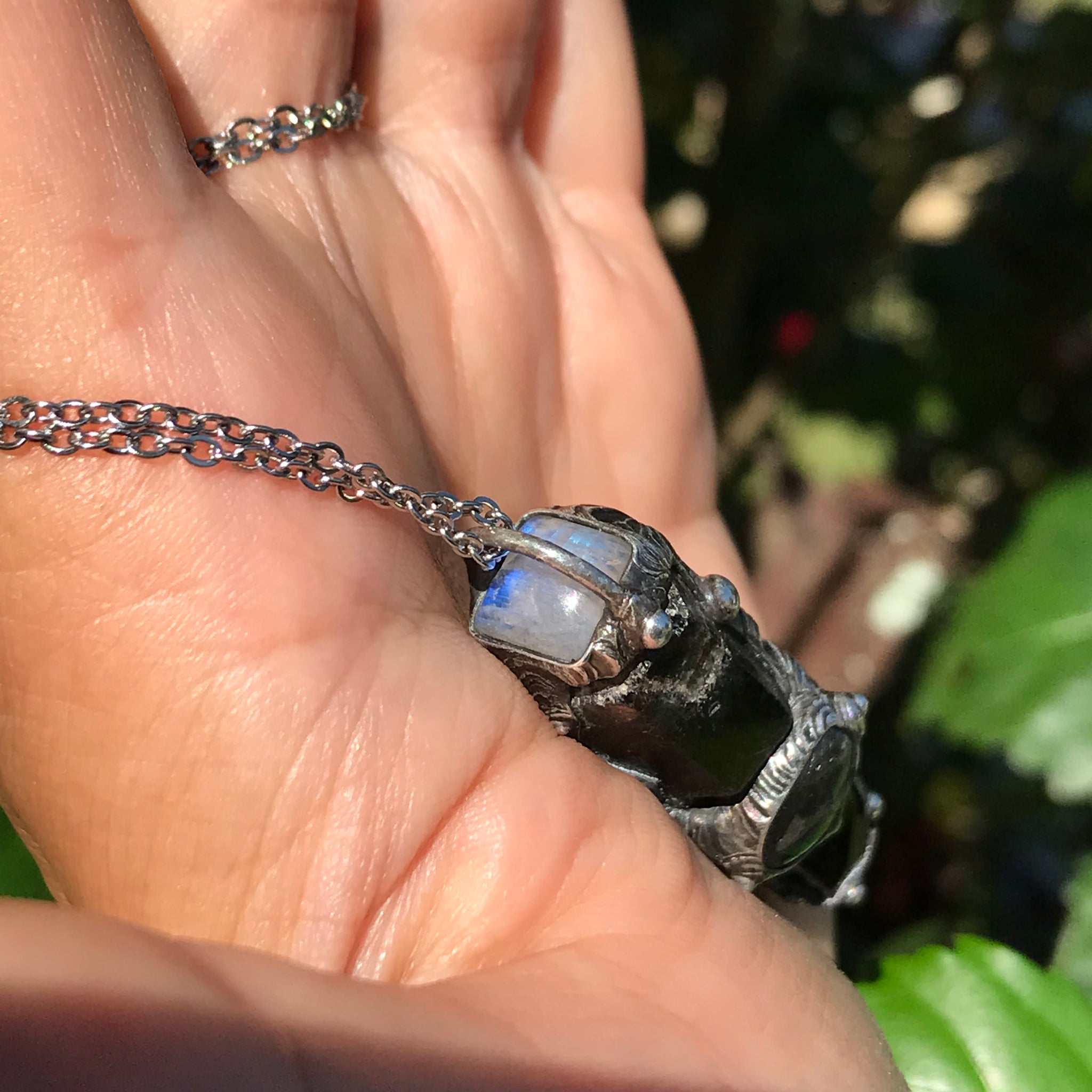 Aegirine and smoky Quartz point adorned with labradorite and rainbow moonstone