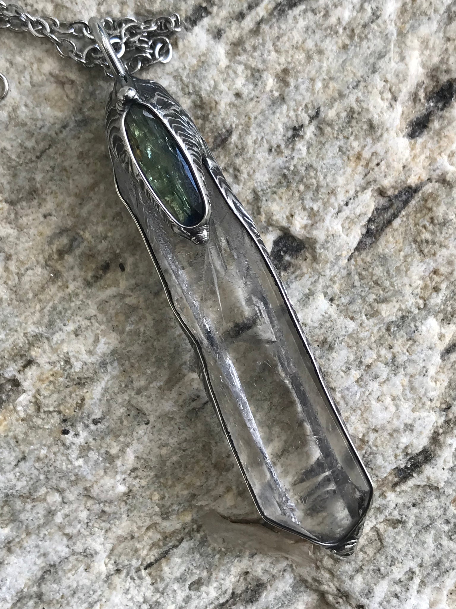 Clear Quartz crystal point with green faceted kyanite