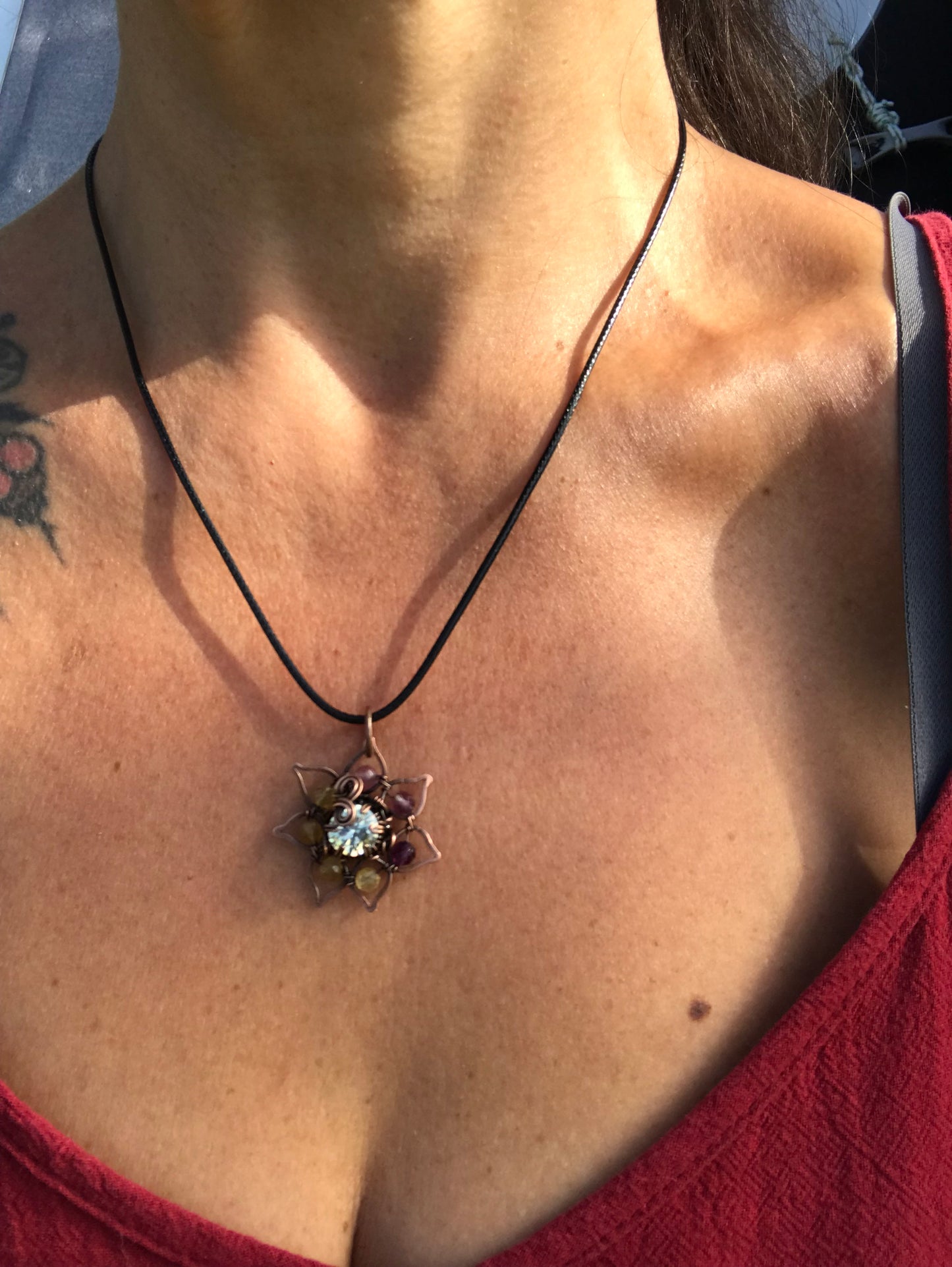 Copper crafted lotus flower pendant with Rainbow Fluorite