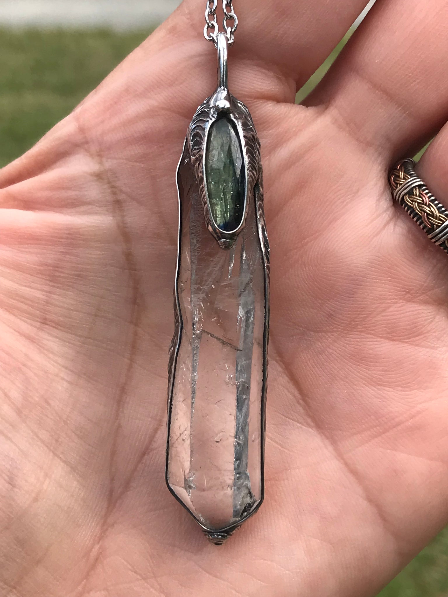 Clear Quartz crystal point with green faceted kyanite