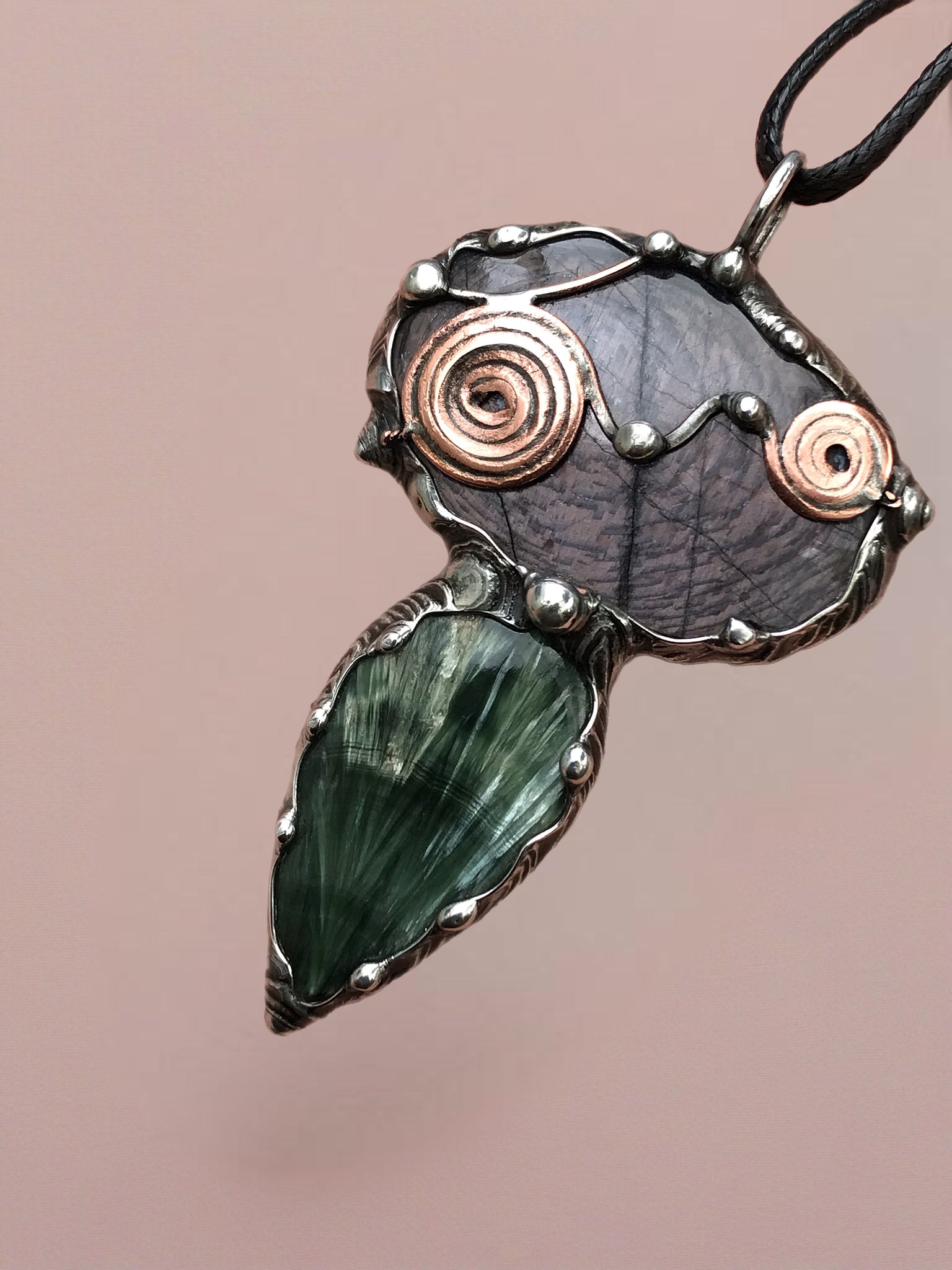 Double spiralled Hypersthene and Seraphinite pendant